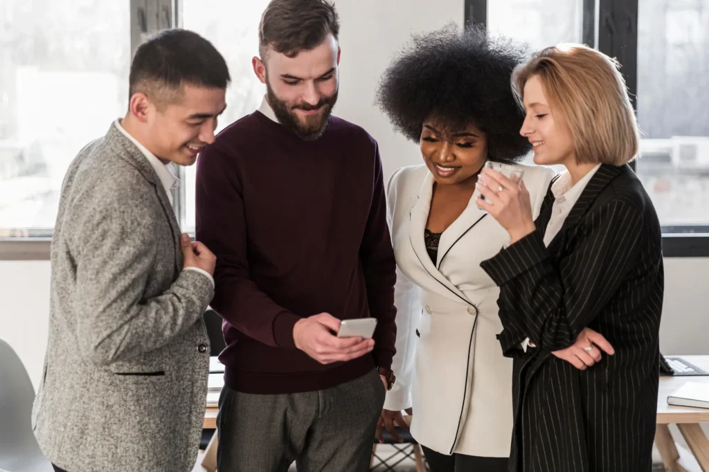 Team looking at phone